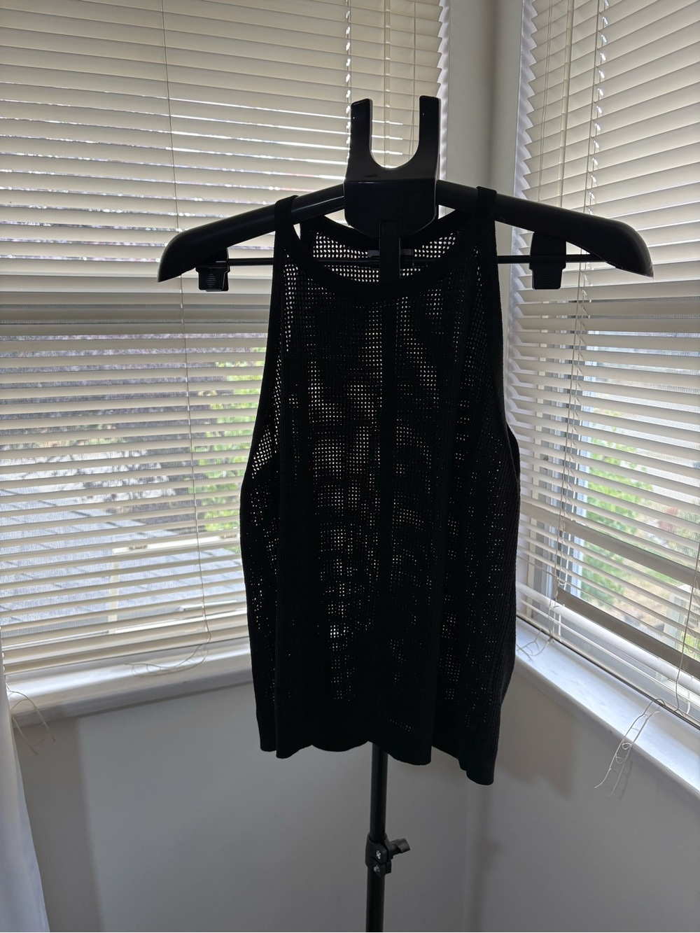 Reitmans sheer black sleeveless tank.